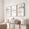 Three framed Bible verse prints with olive branches above a cream sofa