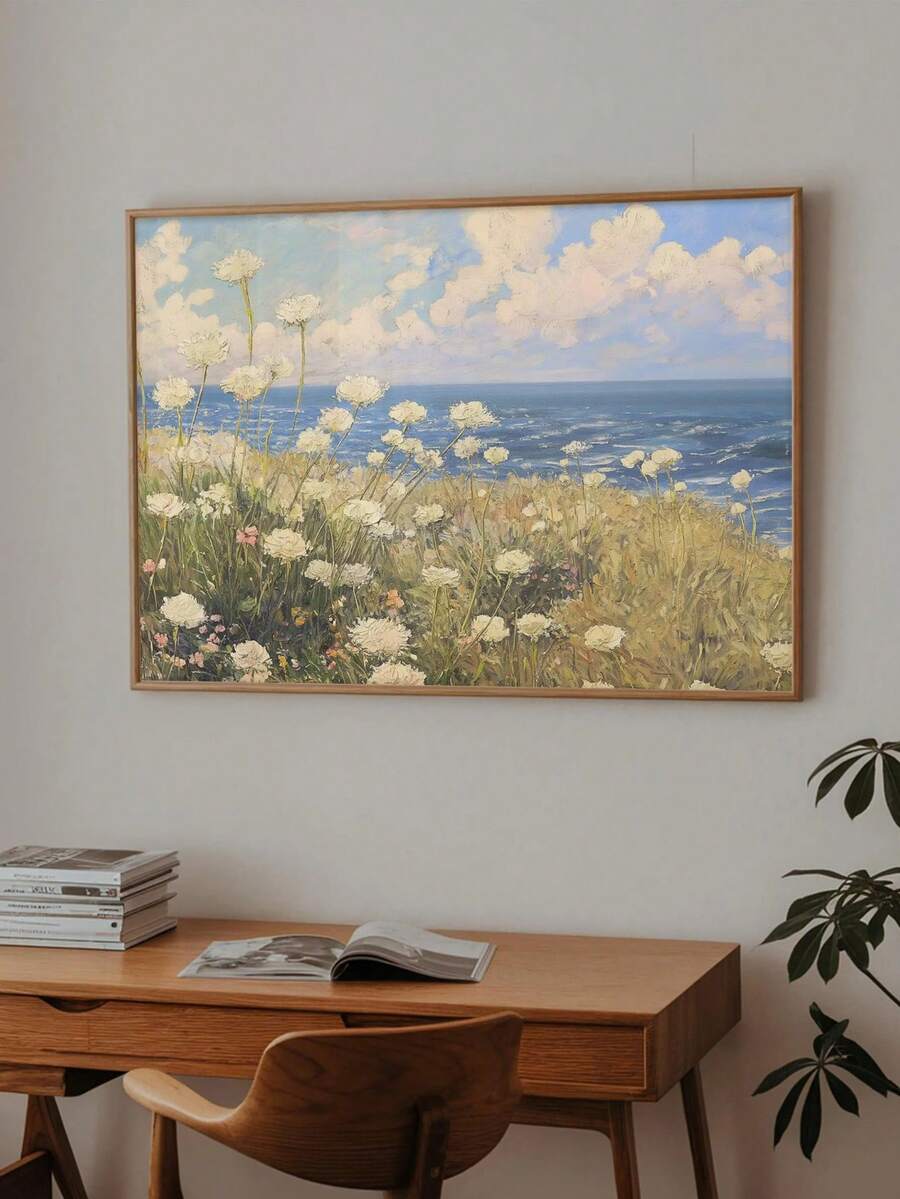 front framed view of Coastal meadow canvas wall art showing white wildflowers, ocean horizon, blue sky, soft clouds and airy impressionist cottage colors.