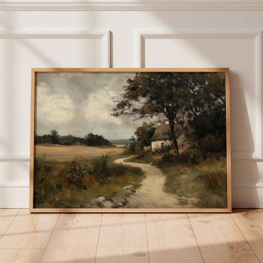 Framed cottage oil painting beside paneled doors