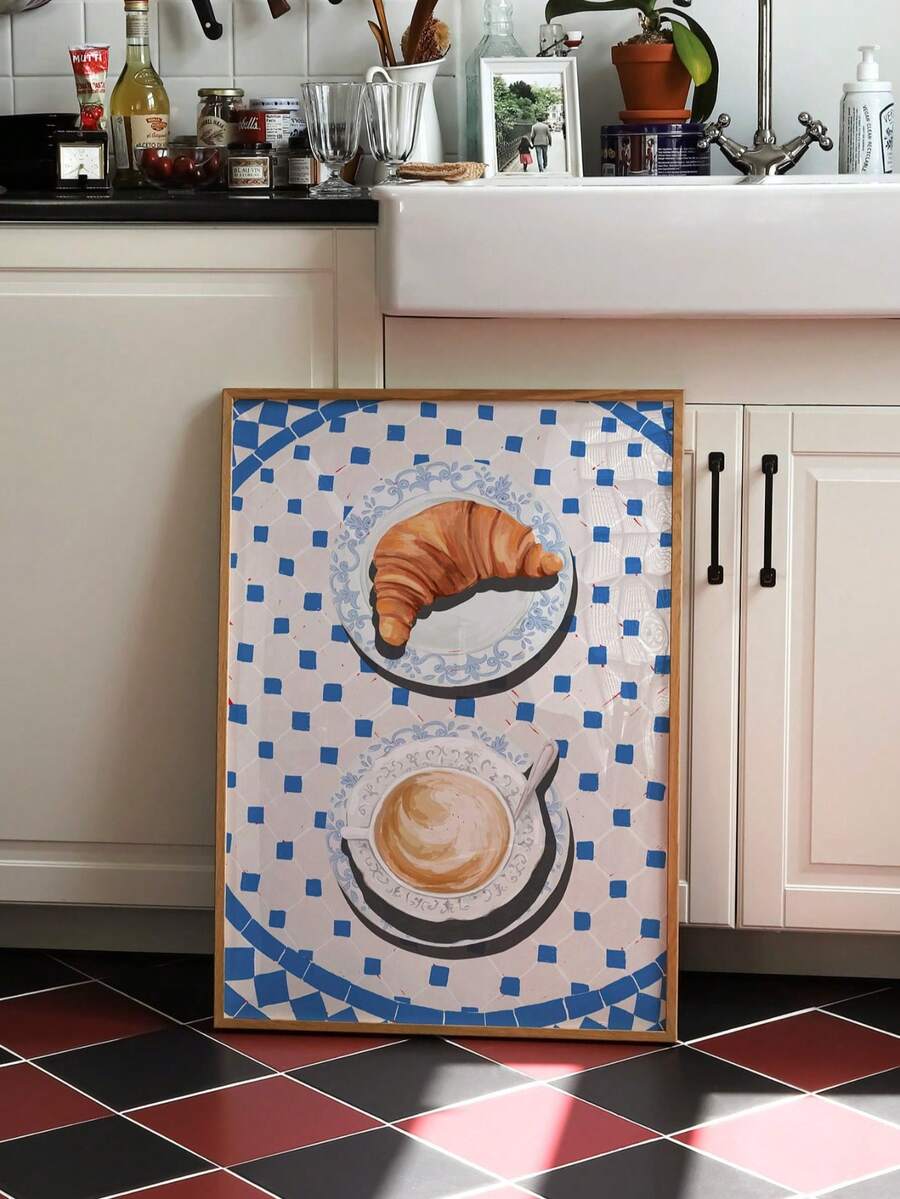 Framed croissant and coffee canvas with a cobalt blue tiled border