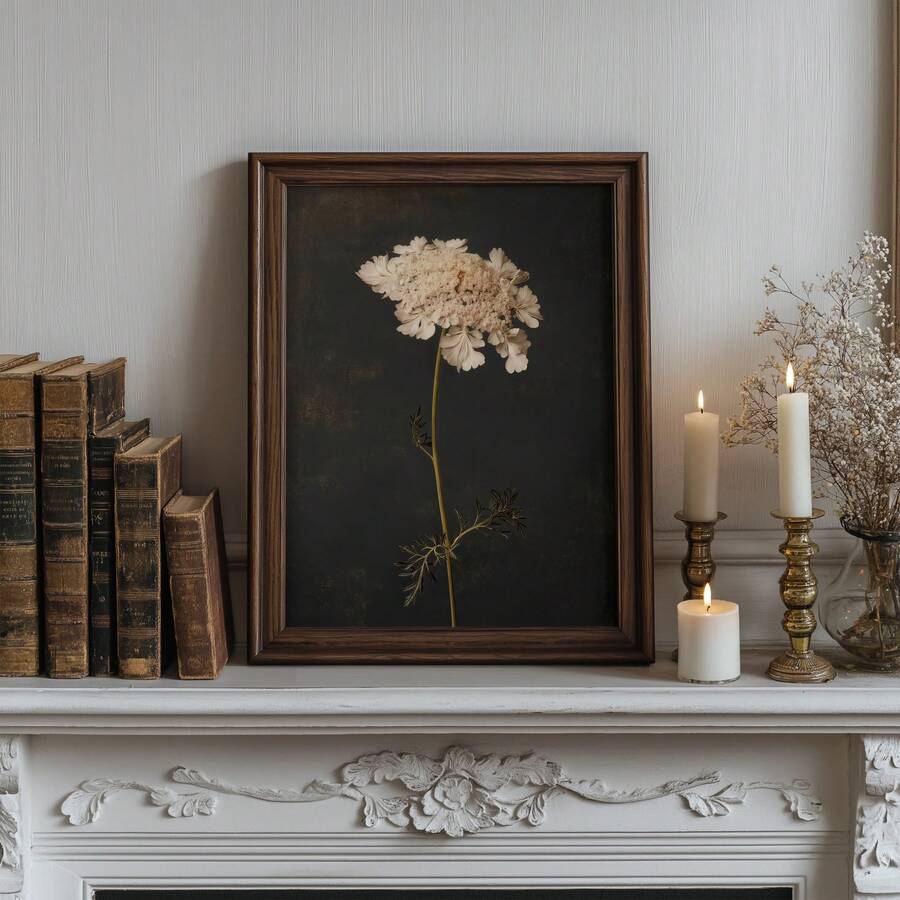 Dark floral wall art on mantel with white wildflower charcoal background books and candles
