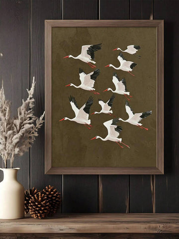 Framed stork artwork above a rustic console with dried botanicals
