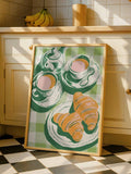 French bistro kitchen wall art with tea cups teapot croissants and green checkered tablecloth