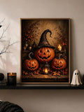 Framed canvas of three glowing jack-o-lanterns with a black witch hat, candle and autumn leaves