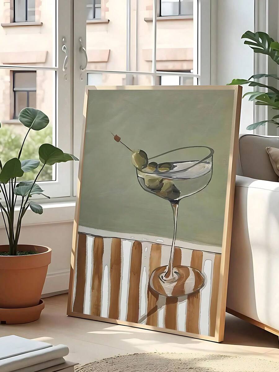 Framed cocktail martini painting leaning by bright window in modern living room
