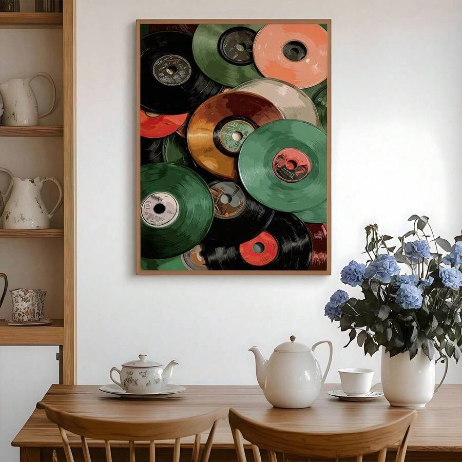 Framed colorful vinyl record collage canvas print above a wooden dining table with hydrangeas
