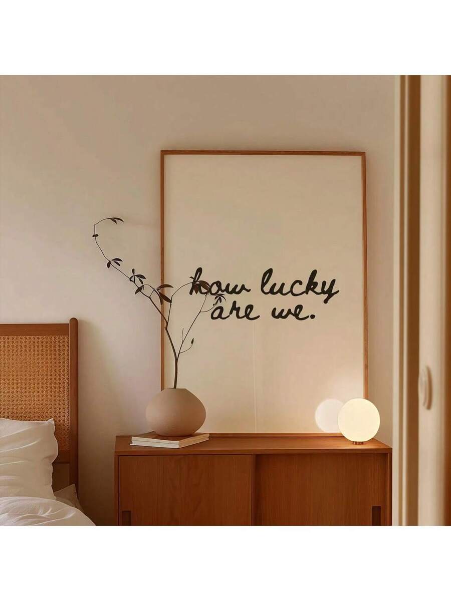 Celebrate life's blessings with this charming vintage-inspired wall art featuring the uplifting message "We Are So Lucky." This versatile canvas print combines heartfelt sentiment with timeless design, making it perfect for bedrooms, living rooms, or dining spaces. Available in multicolor tones with clean lettering, it brings warmth and positivity to any room. The waterproof fabric material ensures durability, while the simple aesthetic complements both modern and traditional décor. Choose between framed or