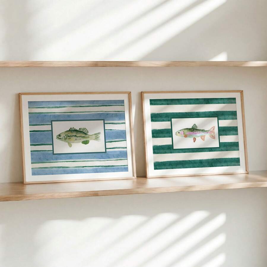 Two framed watercolor fish prints on wood shelf with blue and teal stripes