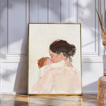 Watercolor mother and baby canvas poster in a gold frame against a paneled wall