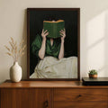Woman reading book poster on wood dresser