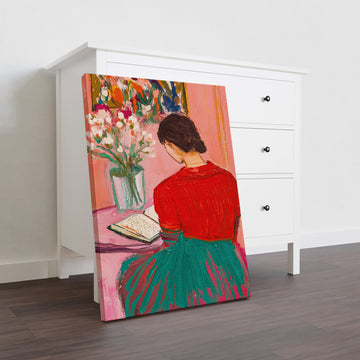 Elevate your interior with this striking canvas wall art featuring a contemplative woman reading portrait rendered in sophisticated red and pink tones. The modern artistic style brings contemporary elegance to any space, making it an ideal focal point above your sofa, in the bedroom, or throughout your home.